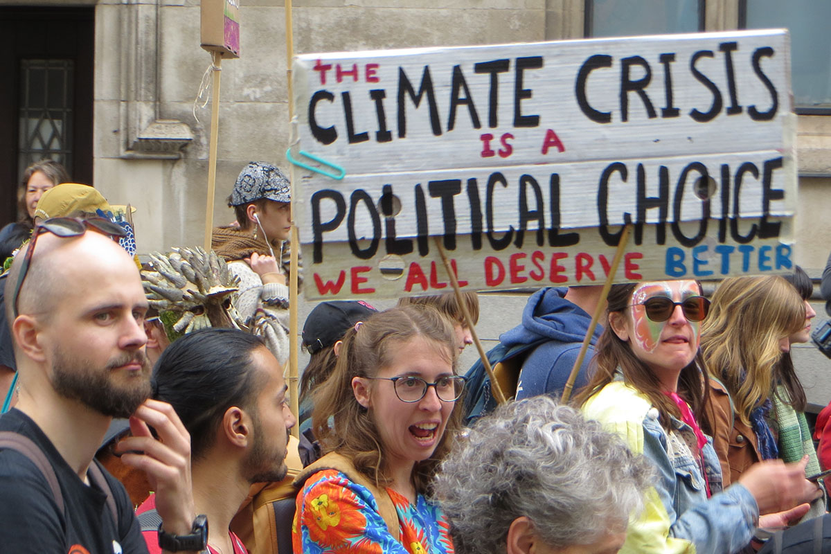 Banner: Climate Crisis is a Political Choice by Mick Holder