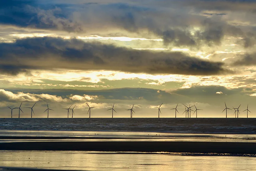Wind Turbines Mersey estuary by Gavin Allanwood on Unsplash